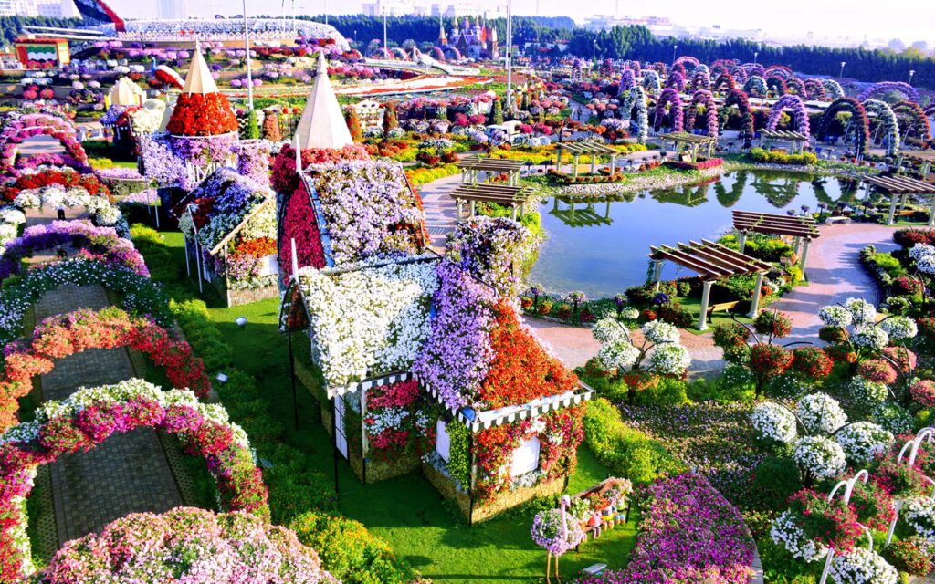 Panoramic view of Dubai Miracle Garden with flower displays and sculptures